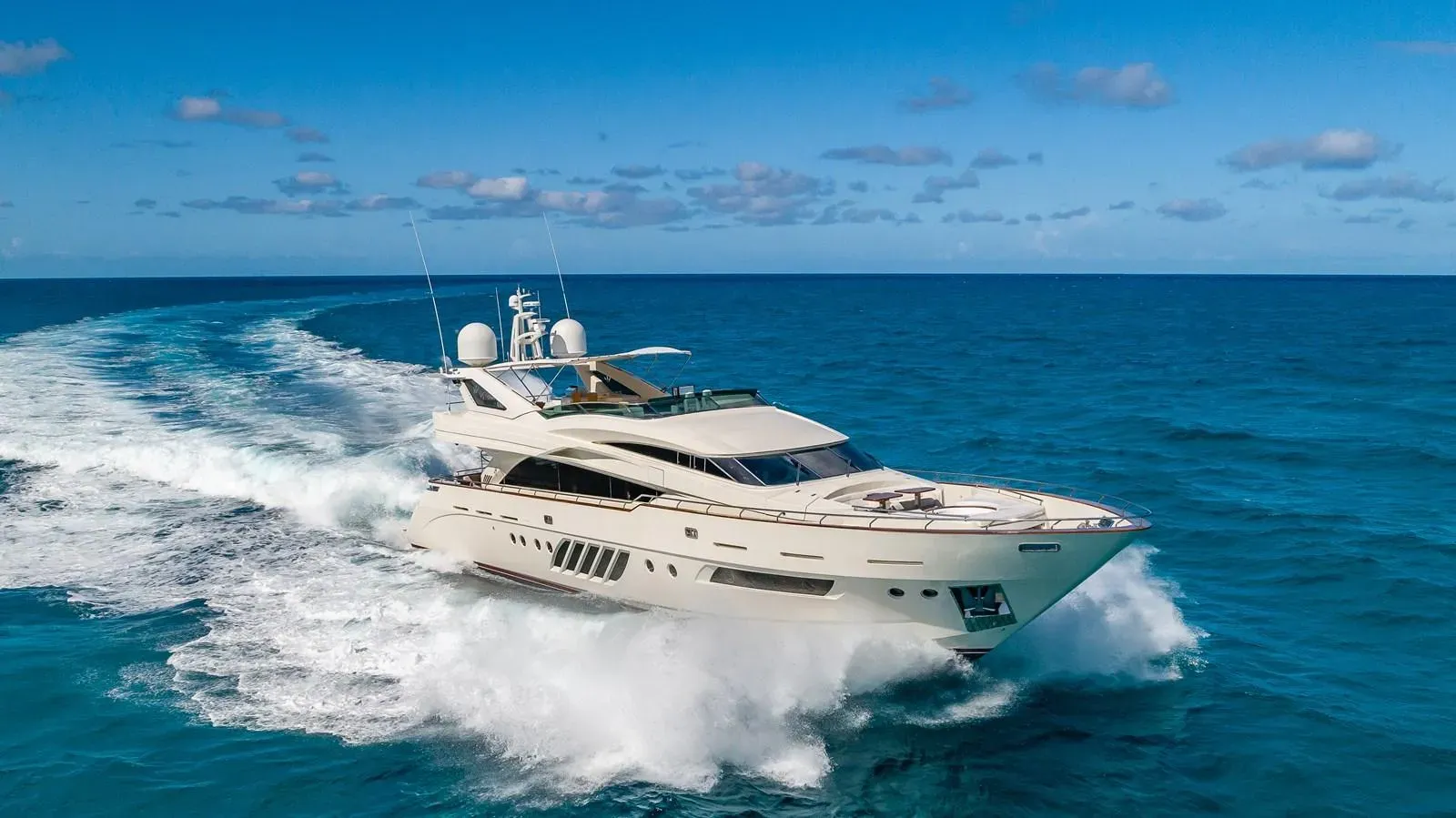 Casual yacht, a 95 ft Dominator luxury superyacht underway, 29.1 meters, built in 2009.