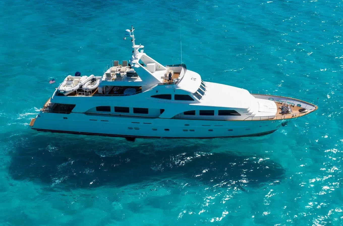 Sunrise yacht, a 108 ft SES luxury superyacht underway, 33 meters, built in 2006.
